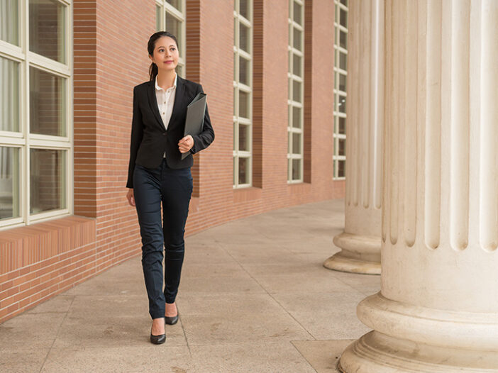 Lawyer Walking Outside Government Building