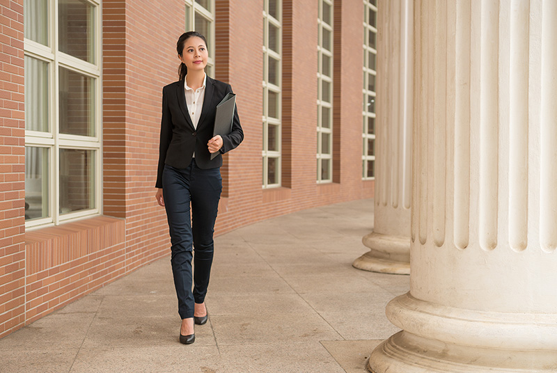 Lawyer Walking Outside Government Building